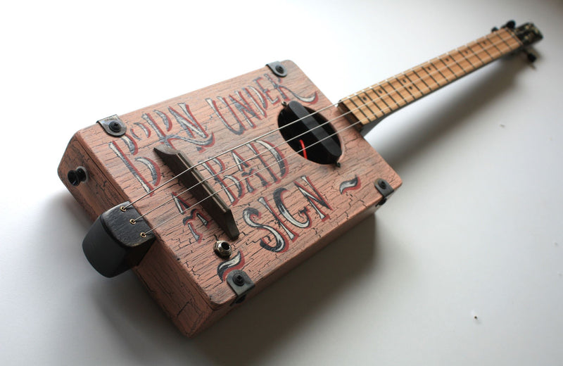 Workshop Series - "Born Under a Bad Sign" Dusk Pink - 3 String Cigar Box Guitar