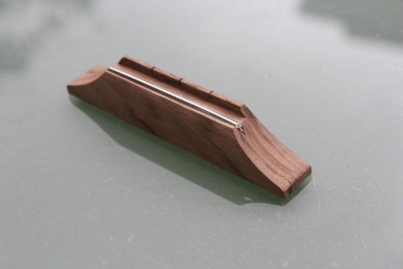 Walnut fretwire saddle/ string spacer bridge, available in various sizes.