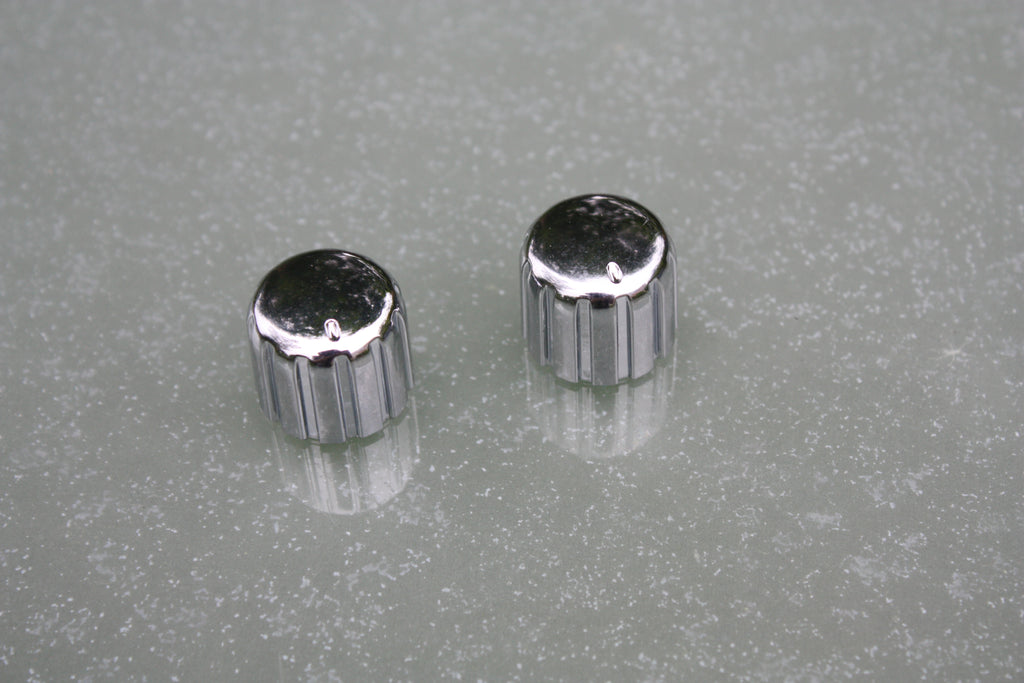 Silver control knobs, pair.