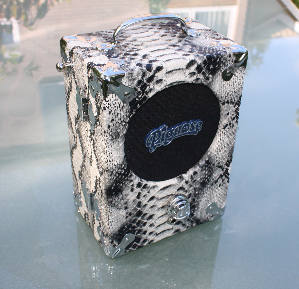 The Legendary Pignose 7-100 Battery Amplifier. Snakeskin covering, requires 6 AA batteries.