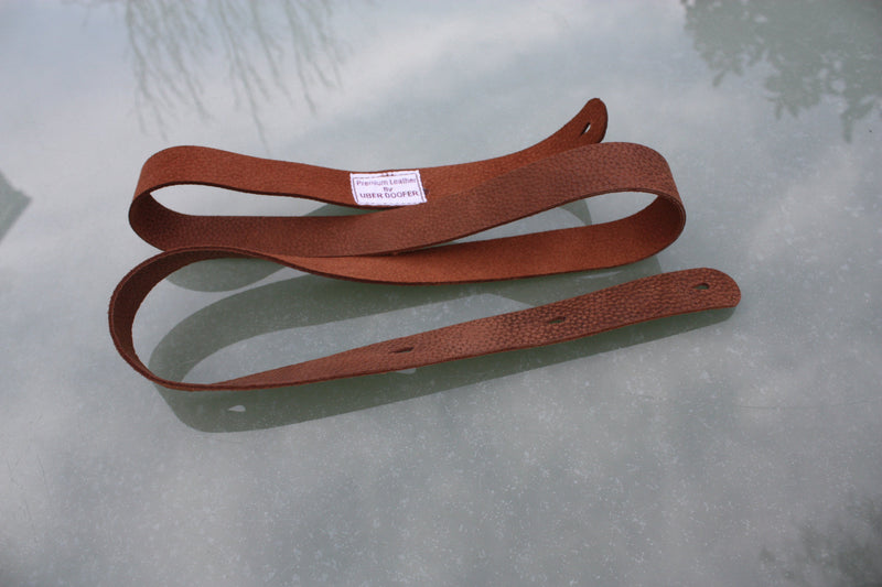 Handmade Uber Doofer Leather Guitar Strap, available plain or with a shoulder pad.