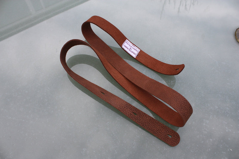 Handmade Uber Doofer Leather Guitar Strap, available plain or with a shoulder pad.