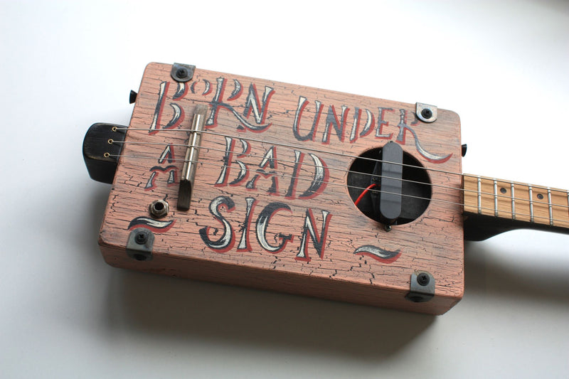 Workshop Series - "Born Under a Bad Sign" Dusk Pink - 3 String Cigar Box Guitar