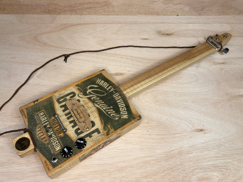 PRE-OWNED "Harley Davidson" Freless 3 string cigar box guitar
