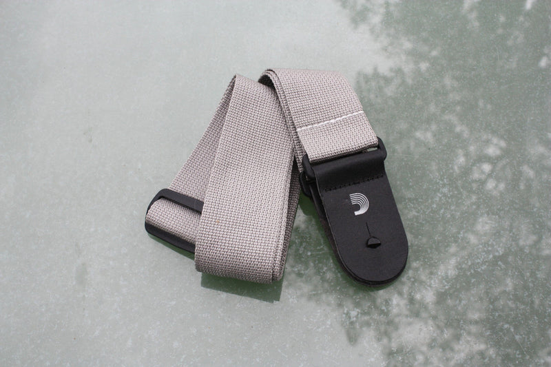 Guitar strap grey made from polypropylen. Made by d'Addario.