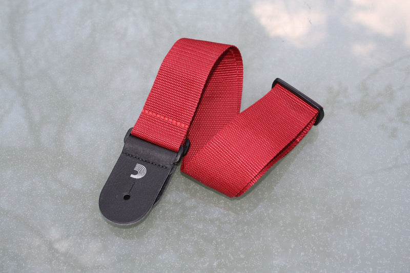 Guitar strap red made from polypropylen. Made by d'Addario.