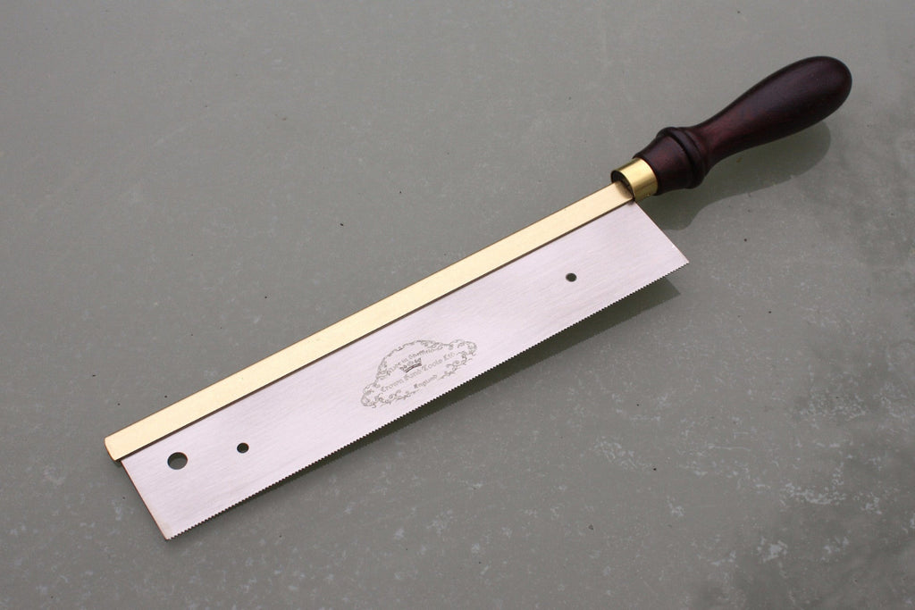 Fretting handsaw by Crown Tools. Steel blade, rosewood handle and brass back.