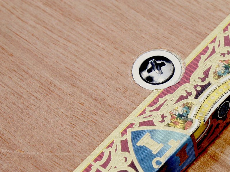 Neck fixing ferrule and screw on a cigar box guitar, ideal for the finishing touch. 