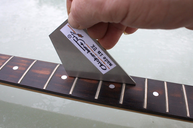 Stainless steel fret rocker to level out guitar frets. 