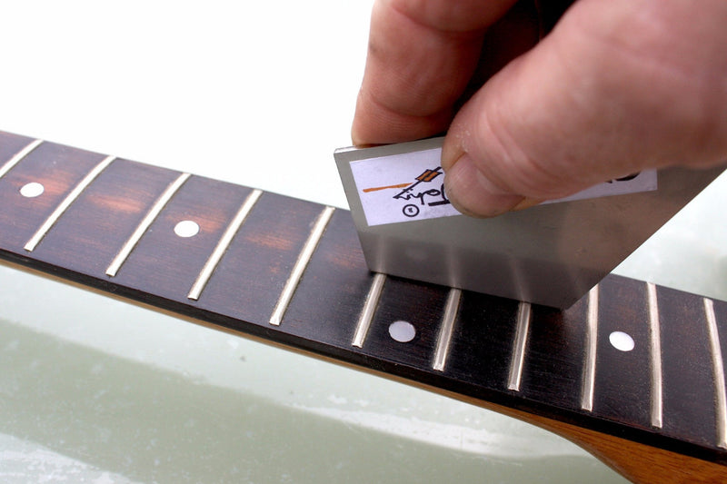 Stainless steel fret rocker to level out guitar frets. 