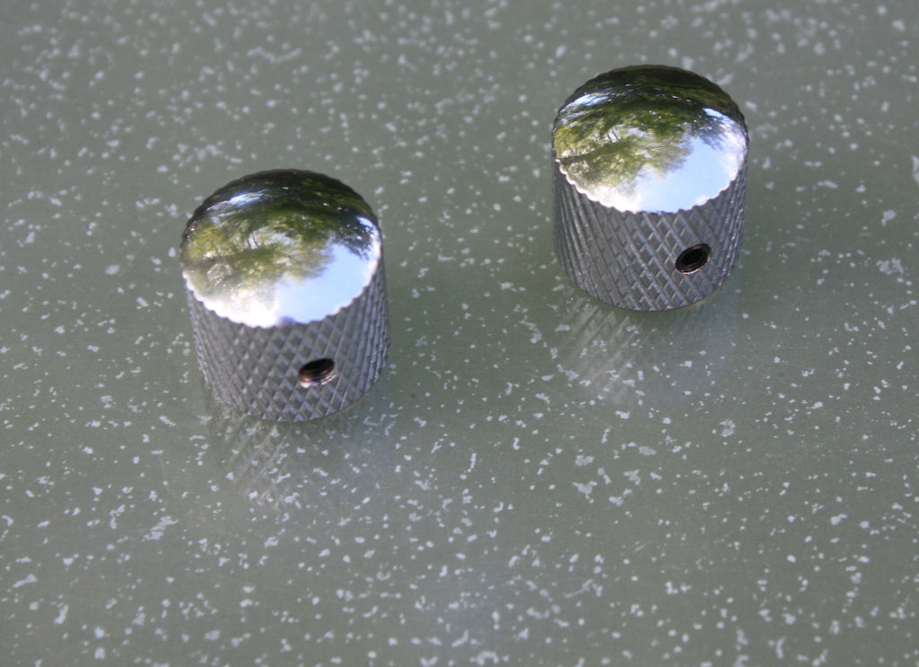 A pair of Telecaster style chrome control knobs